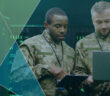 Two military personnel stand together with digital technology. Banner for AFCEA digitalisation in defence live panel